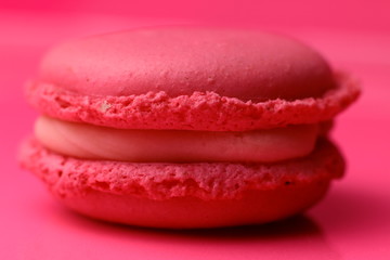Pink macaroon on pink background. 