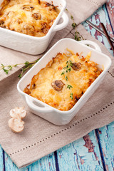 Traditional cheese casserole in a portion plate. Close up and vertical view.