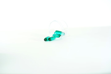 Green pill Vitamin, capsule isolated on white background