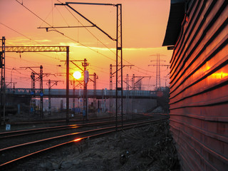 Railway infrastructure at sunset.