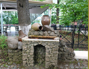 Earthenware jugs on large stones