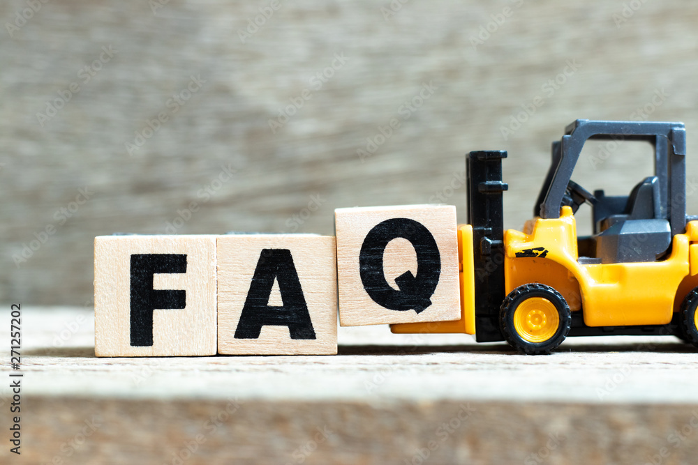 Poster Toy forklift hold letter block q to complete word FAQ (Abbreviation of Frequently Asked Questions) on wood background