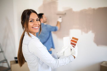 Couple renovating apartment.
