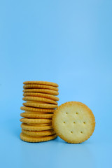 Heap of cracker on blue background, Stack of cookies and blue backdrop, Snack on vintage background