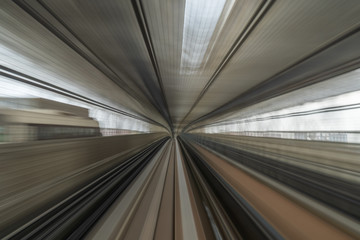 motion blur of train running on tunnel in Tokyo, Japan