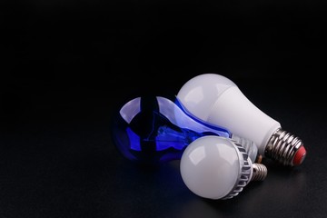 Set with different types of lamp bulbs on black background