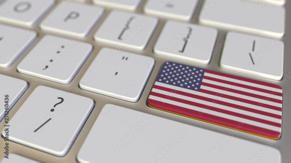 Poster key with flag of colombia on the computer keyboard switches to key with flag of the usa, translation