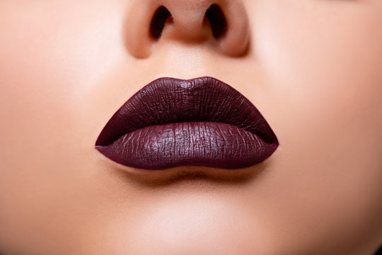 Beautiful lips macro. Beauty. mouth. makeup. Closeup Model lips dark red in Studio. - image  