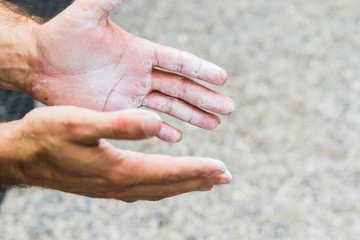 Man practicing rock climbing on artificial wall indoors. Active lifestyle and bouldering concept..