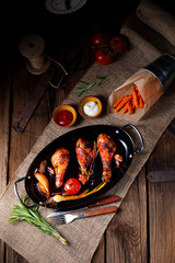 grilled chicken legs in barbecue marinade with sweet potatoes