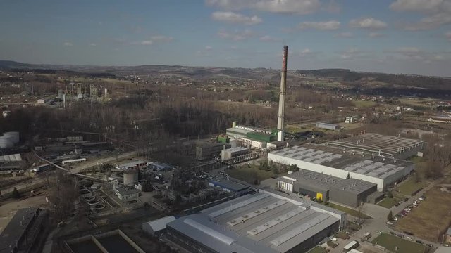 Gorlice, Poland - 3 9 2019: Industrial region of the Carpathian city. Top view of the refinery and auxiliary buildings. Video shot by drone or quadrocopter. Vanity of the day at the factory. Planning 