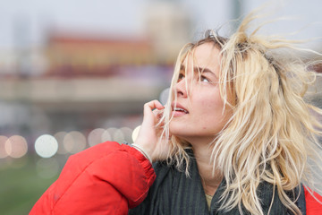 Young woman outdoors on a cod windy day