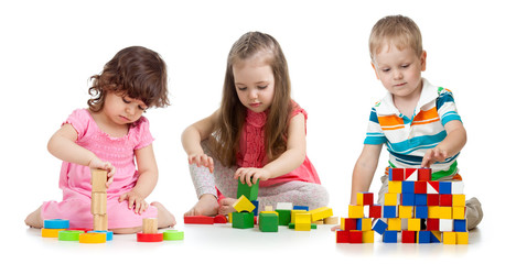 kids playing wooden blocks toy isolated on white background