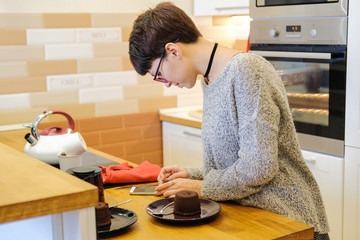 Portrait of woman cooking dessert.