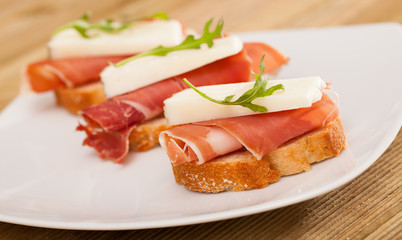 perfect sandwich made with rye bread cheese and Parma ham