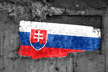 The flag of Slovakia on a dirty wooden surface, built into a concrete base, with scuffs and...