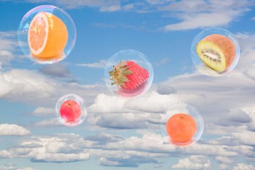 Five fruits inside five bubbles in the sky flying