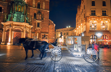 Carriage at night in Krakow, Poland.