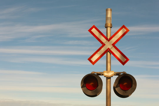 Railroad crossing signal lights and sign.