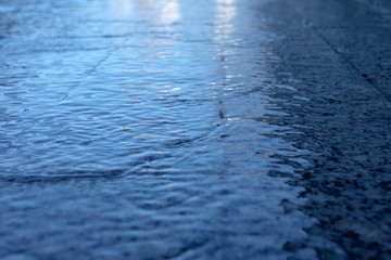 Wet road after rain in blue