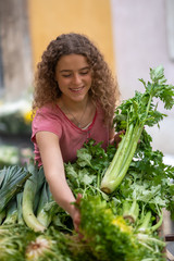 Young woman at the vegetable  food market 