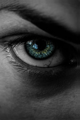 Obraz premium Girl with green eye close up and black and white