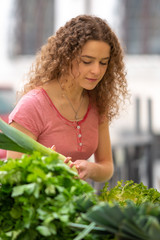 Young woman at the vegetable  food market 