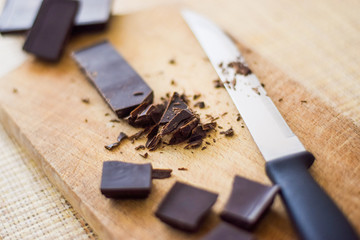 Cut chocolate on the wooden board