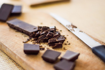 Cut chocolate on the wooden board
