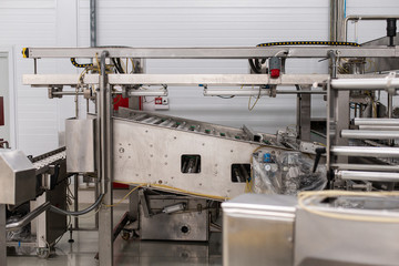 Ice cream production line. Conveyor production. Machine for conveyor line. Selective focus.