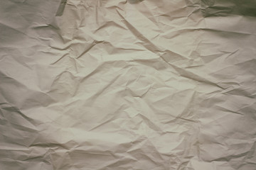Old crumpled paper texture background.  Creases and cracks. Old design pattern. 