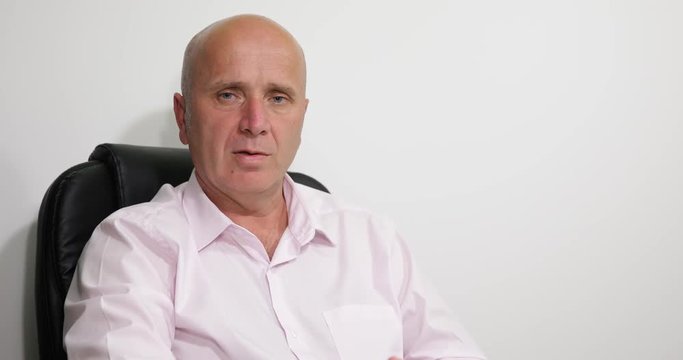 Manager in Interior Office Talking Confident in a Interview about Financial Prob