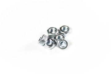 Silver metal nuts on a white isolated background