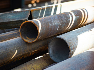 Rusty industrial metal pipes with corrosion
