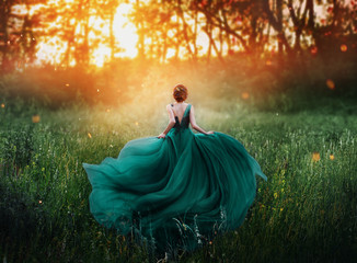 magical picture, girl with red hair runs into dark mysterious forest, lady in long elegant royal expensive emerald green turquoise dress with flying train, amazing transformation during fiery sunset