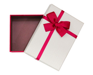red gift box with ribbon and bow on red background