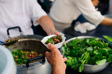 the concept of hope : Hand-feeding to the needy in society : Concept of Feeding : Volunteers give food to the poor : donating food is helping human friends in society