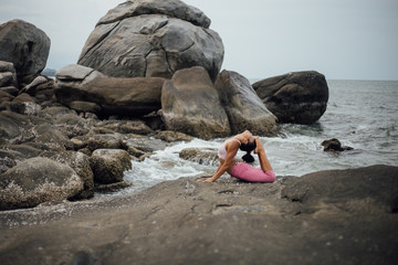 Asian girl practice Yoga on the beach Sunrise morning day