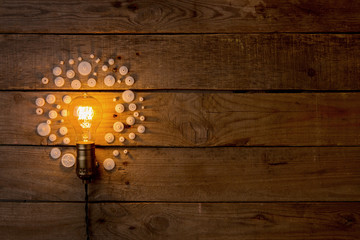 Idea and teamwork business concept, vintage incandescent light bulb and jigsaw on the wooden background