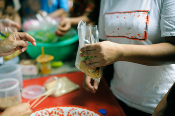 Hand begging for food from the rich's share : The beggar is waiting for food from charity aid : the...