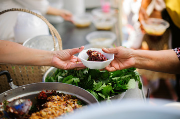 Hand begging for food from the rich's share : The beggar is waiting for food from charity aid : the...