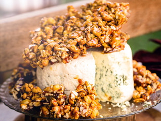 Tasty gorgonzola cheese with praline, cheese dish decorated for events, typical food at social...