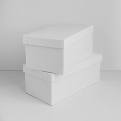 Two white cardboard boxes isolated on white background. Box mockup design. .
