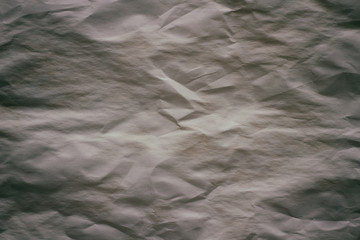 Old crumpled paper texture background.  Creases and cracks. Old design pattern. 