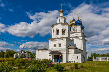 Fototapeta na wymiar Restored ancient Orthodox church with glittering colored domes