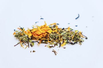 Dry tea from useful herbs and flowers on a light background