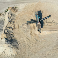 Fototapeta na wymiar Aerial view of the processing machine, the extractor, in a sand quarry, drone shot