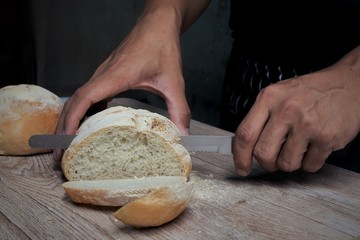 woman cutting bread