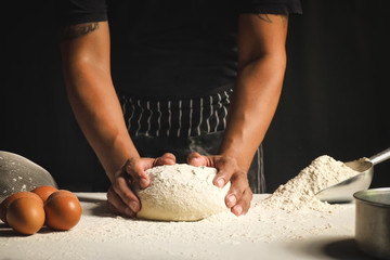 Chef is kneading dough