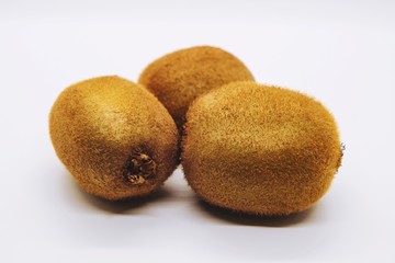 Ripe kiwi fruit on white background